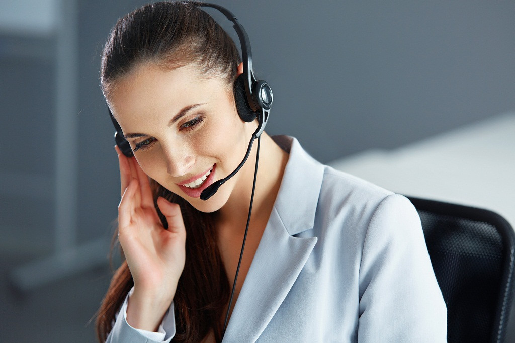 Call Center Operator Sitting Infront of Her Computer